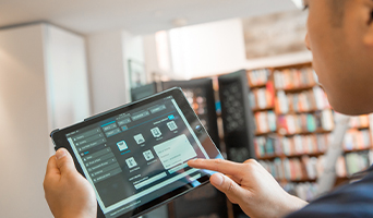 A Scorecard assessor uses a tablet to enter data into the Scorecard software