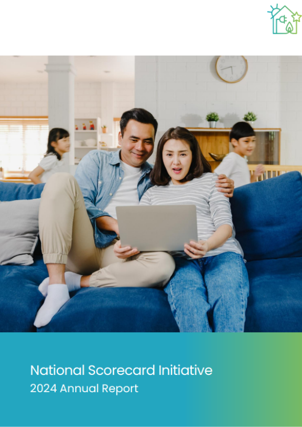 People on coach looking at laptop with happy faces